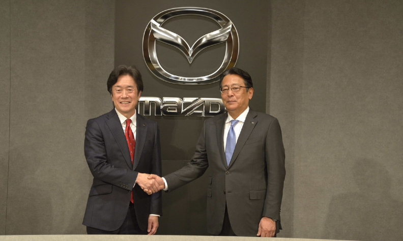 Mazda's Masahiro Moro, left, is pictured with Akira Marumoto